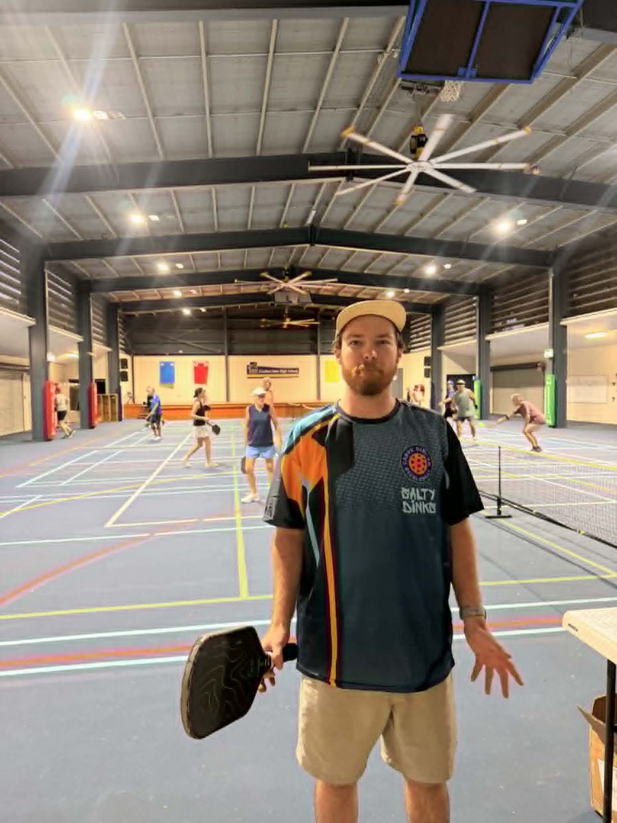 Player with paddle on court